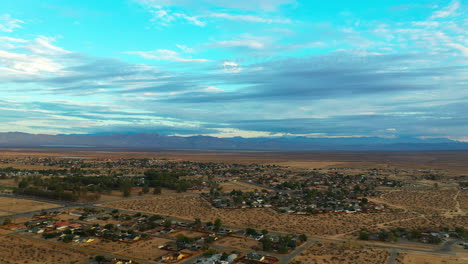 scenic aerial parallax view of california city in the mojave desert on a picturesque day