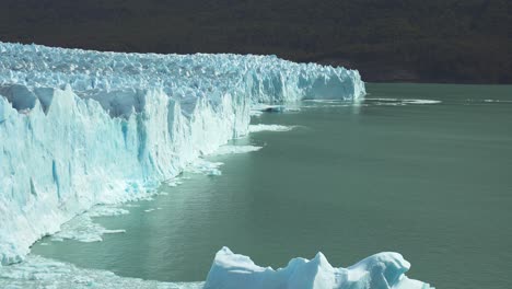 a glacial break generates a wave in perito moreno glacier, patagonia argentina