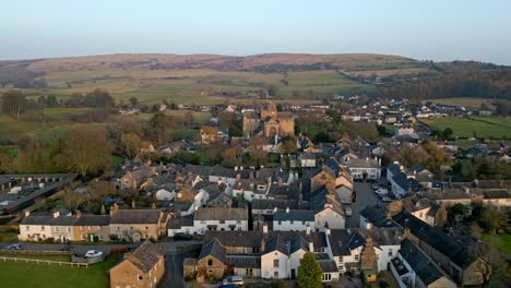 Aerial-footage-of-the-Medieval-village-of-Cartmel-in-the-English-Lake-District-it-has-a-rich-heritage,-and-varied-list-of-activities-for-visitors-and-tourists