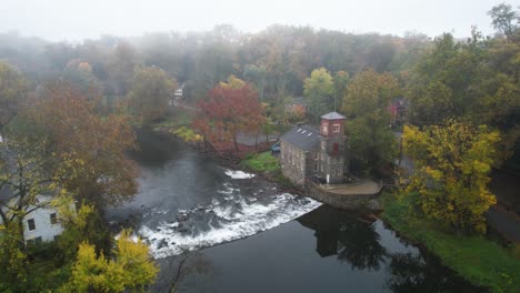 historic mill on river drone shot foggy autumn morning amazing leaves