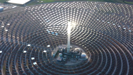 sun reflecting on giant mirrors concentrated solar power gemasolar spain aerial