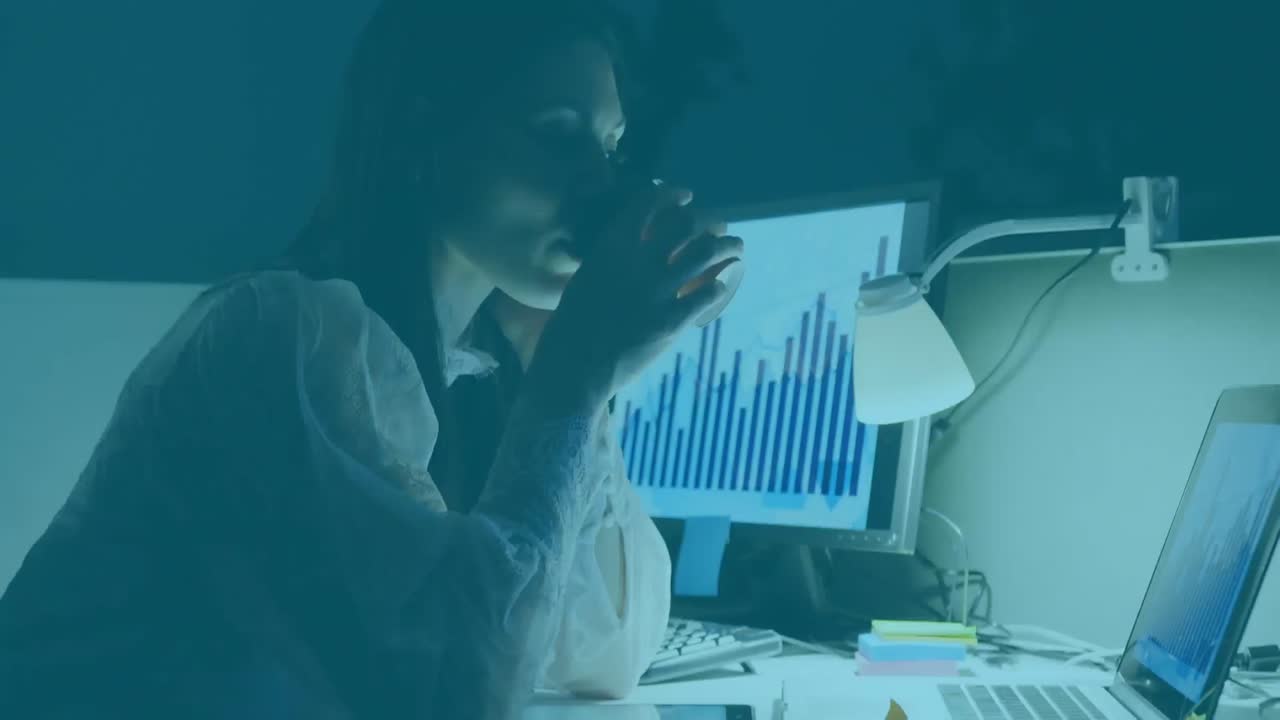 Animation of colorful blots and shapes over businesswoman using computer