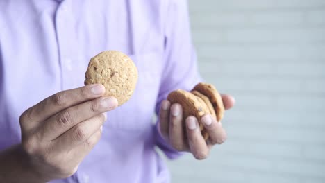 person holding oatmeal cookies