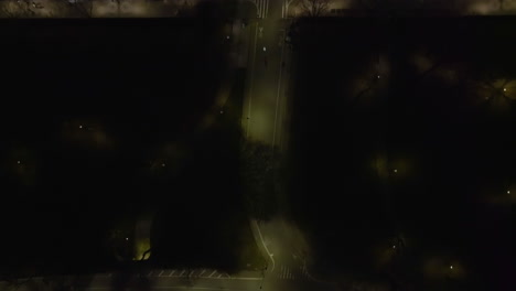 aerial view above the 59th street and the west drive in central park, night in new york, usa - cenital, drone shot