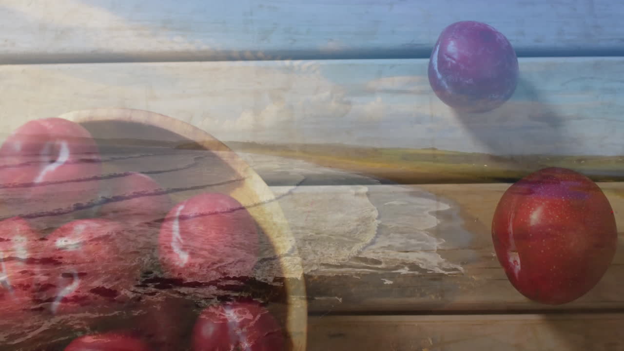 Red apples in bowl on beach with wooden texture, creating animation effect