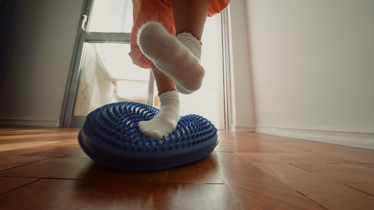 Using a Balance Board for Exercise and Foot Massage