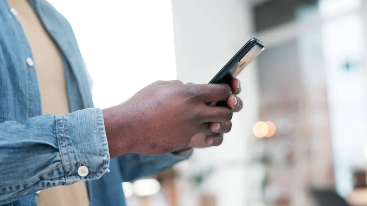Man, hands and typing on smartphone in home
