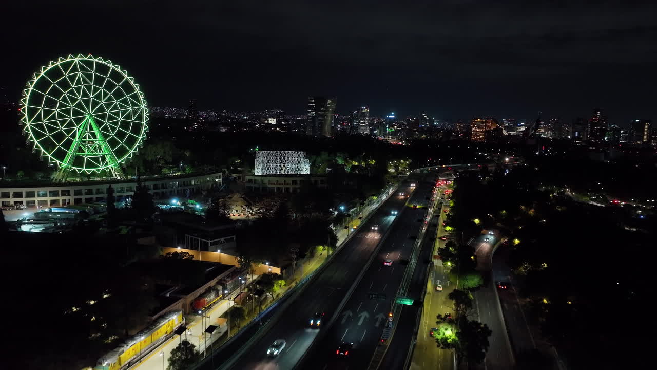Aerial view rising over traffic on the Periferico, nighttime in Mexico city