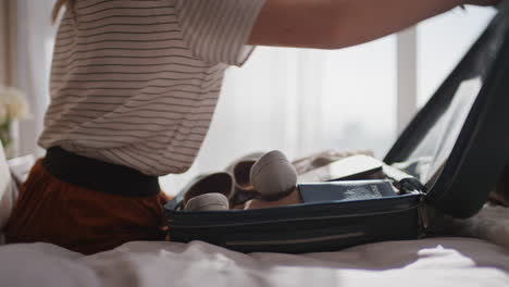 travel woman packing suitcase getting ready for road trip preparing luggage for vacation