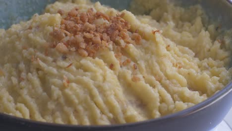 ready mashed banana plantain puree on a turning table, fast forward