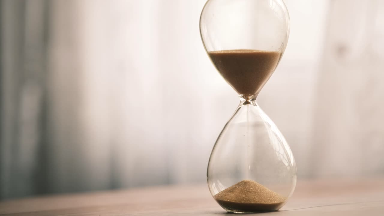 Hourglass on a Wooden Table