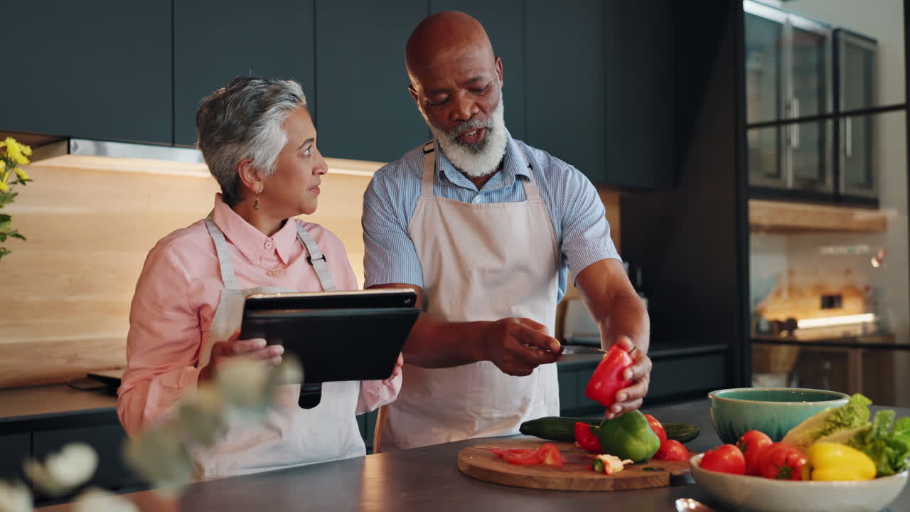 A couple preparing vegetables in the kitchen
