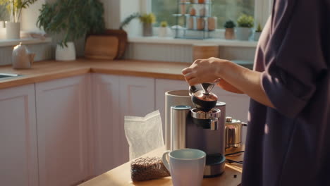 person preparing coffee in a modern kitchen