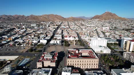 drone shot of downtown chihuahua city and main plaza buildings