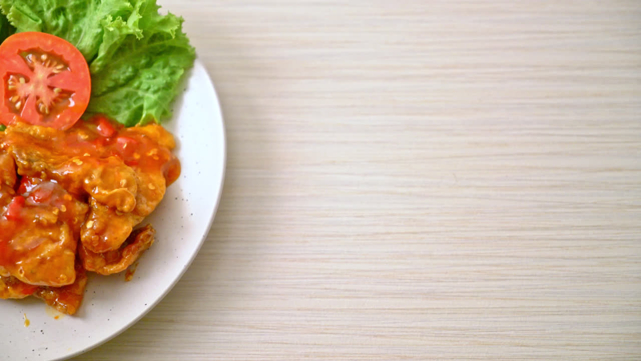 Fried fish topped with three flavors (sweet, sour, spicy) chili sauce