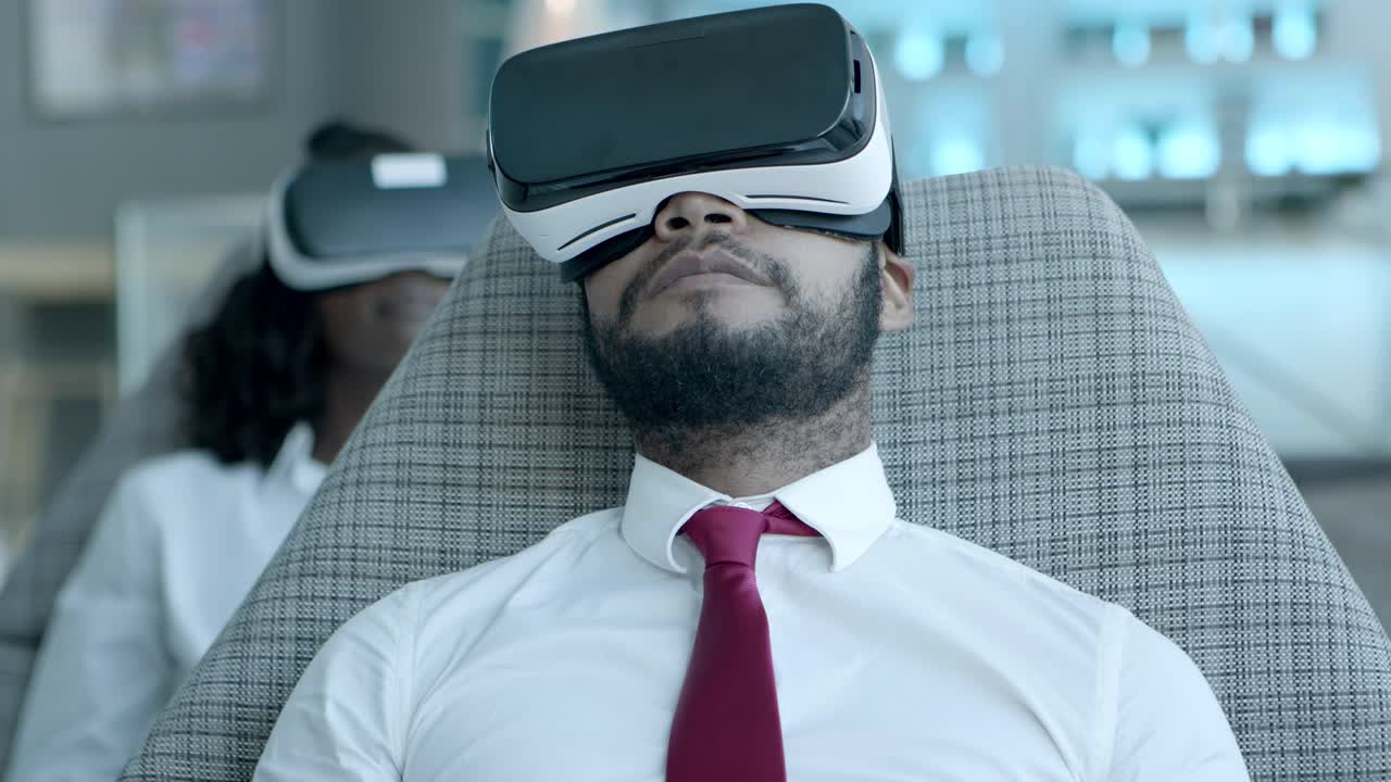 Smiling coworkers in vr headsets