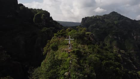 an orbital shot of the cross that sits high above the mexican pueblo magico of tlayacapan