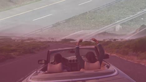 animation of road over biracial couple in car road trip