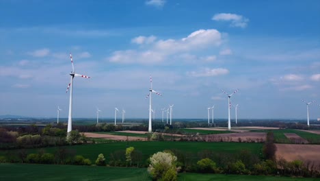 aerial - wind turbines in a wind energy farm in austria, wide shot right