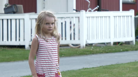 scandinavian young girl with apartment buildings in background