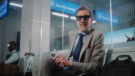 businessman waiting at airport security