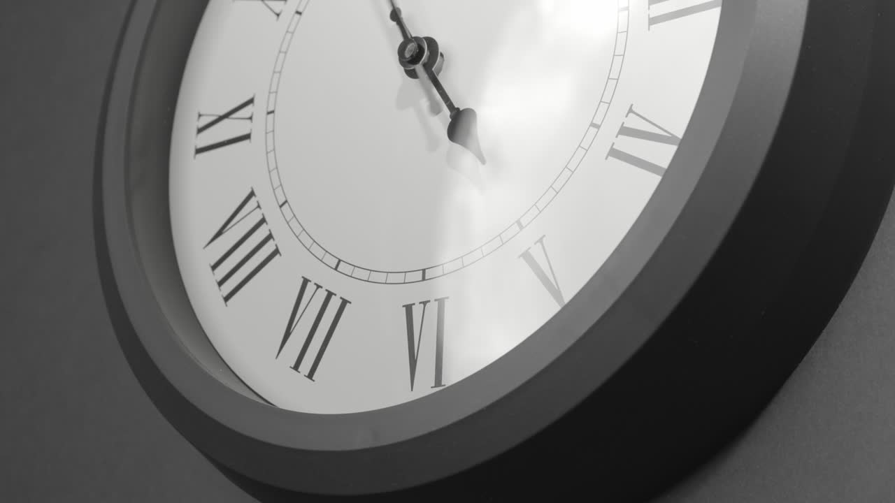 Latin Clock Face in Time Lapse on Dark Grey Wall