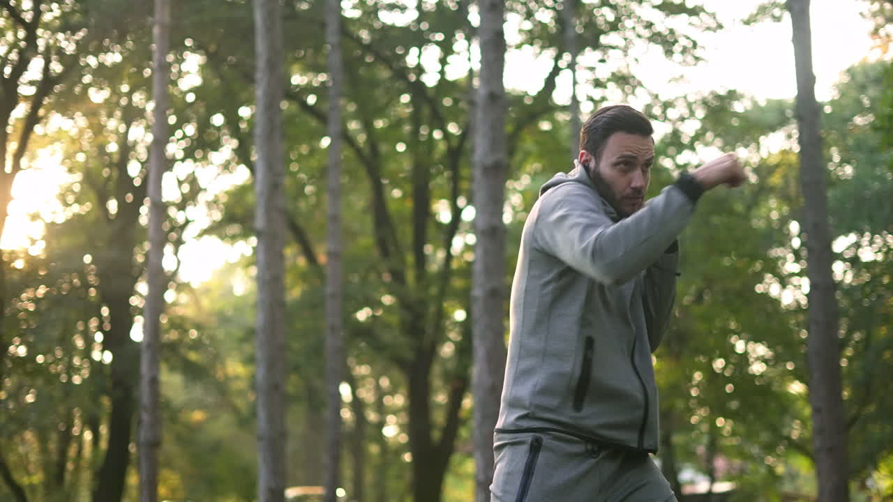 Man boxing in forest