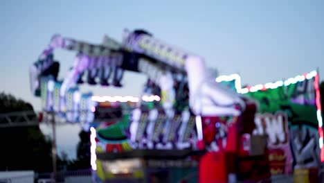 colorful carnival ride spinning at dusk