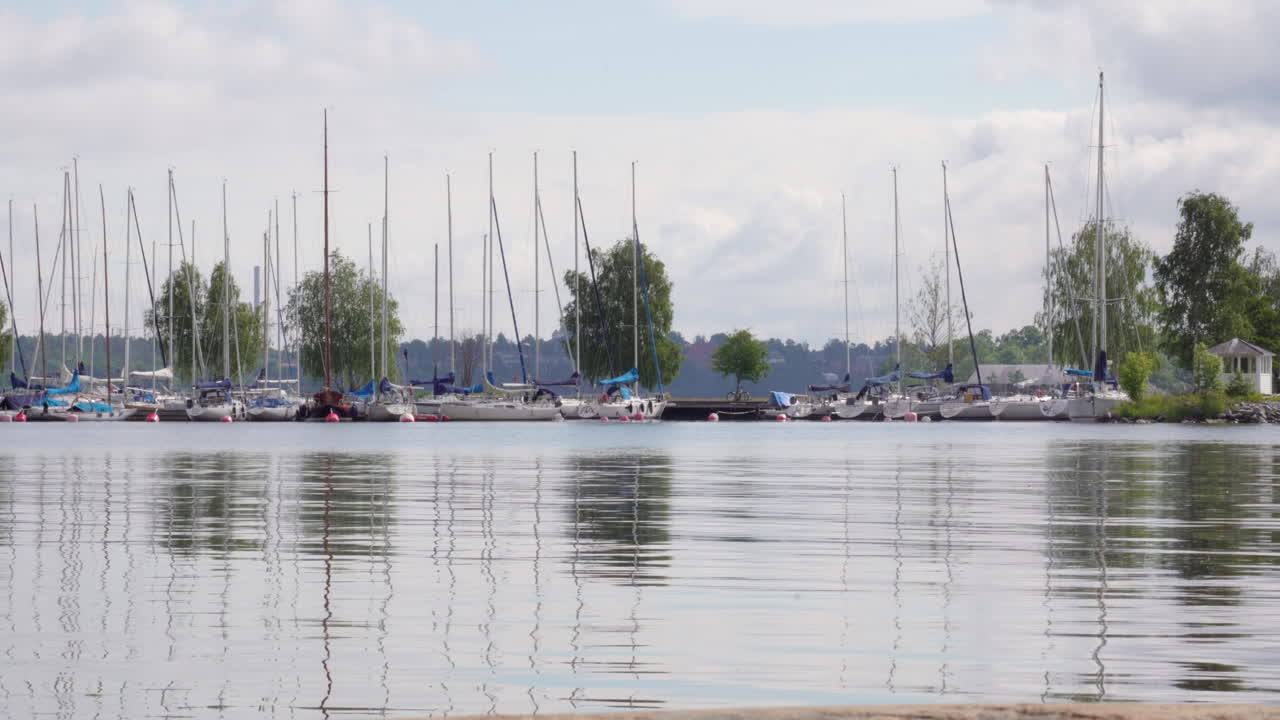 Static footage of a harbor with sail boats
