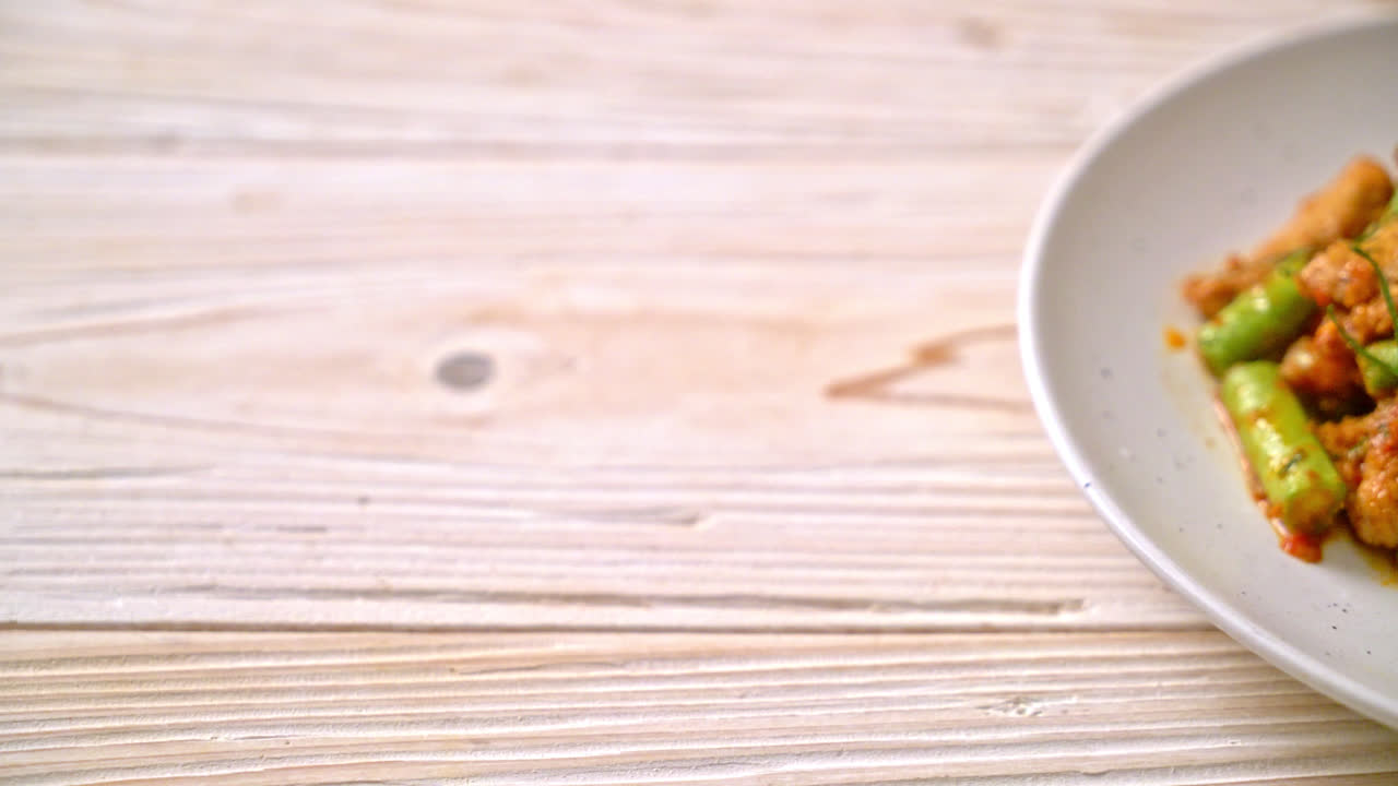 Stir fried pork and red curry paste with sting bean - Asian food style