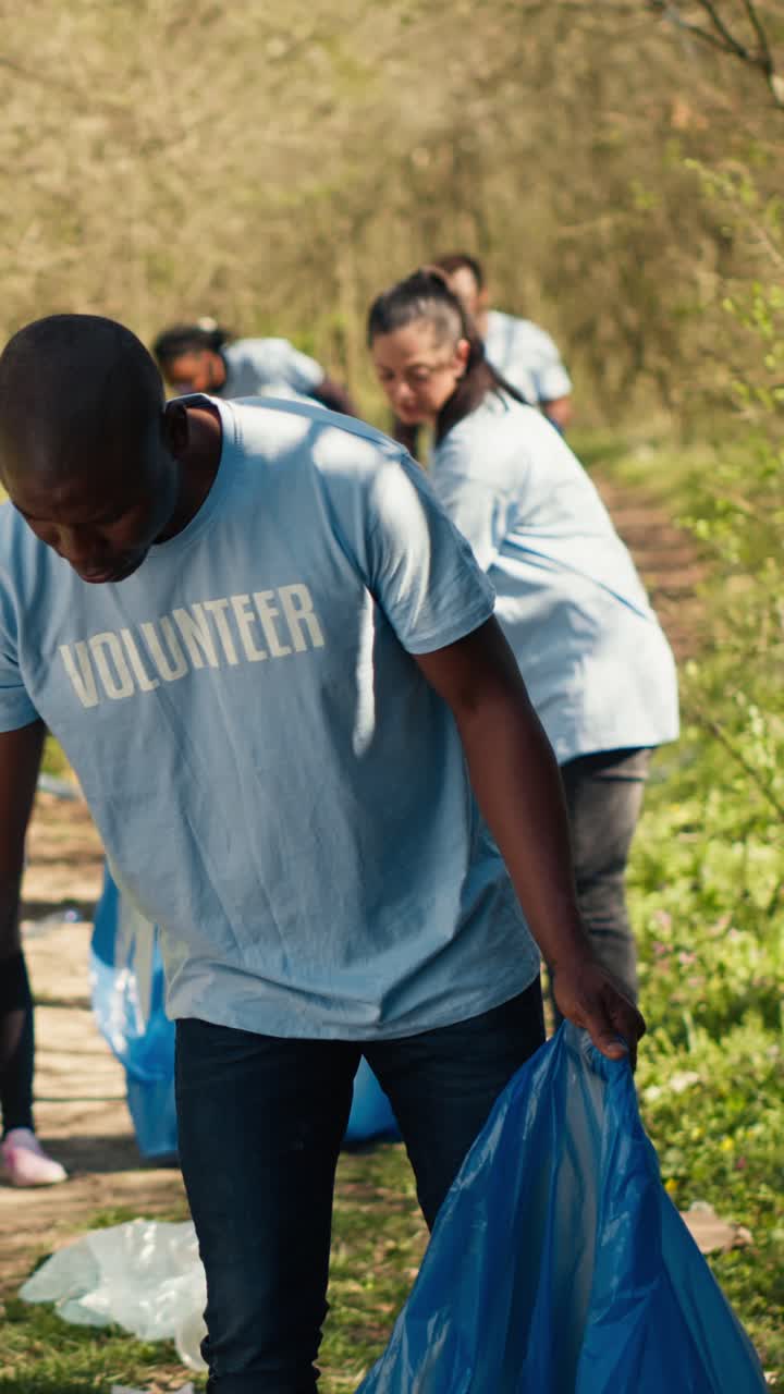 Volunteers Cleaning Up Park Litter with Trash Pickers and Bags