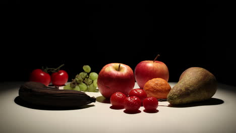 fruit decomposition time lapse with black background, static shot