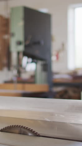 a woodworking workshop with tools and workbench in focus