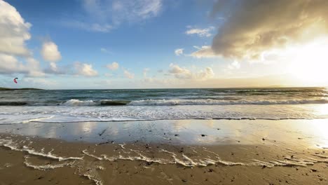 beautiful sunset over atlantic ocean from a sandy beach in ireland