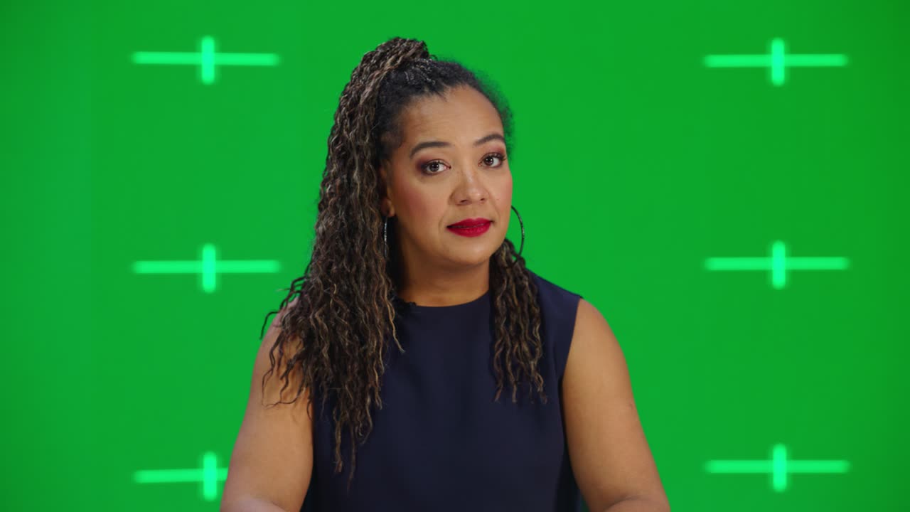 Newsroom TV Studio Live News Program with Green Screen Background: Female Presenter Reporting, Talking. Television Cable Channel Anchorwoman. Network Broadcast Mock-up Playback with Tracking Markers