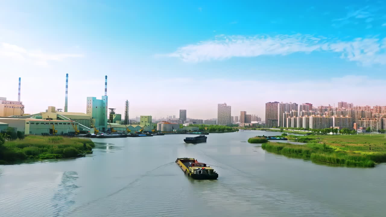 A green river flowing through a heavily industrialized city, with factories and bridges towering over the water.