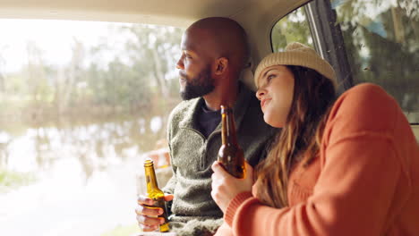 Road-trip,-beer-and-couple-relax-in-car