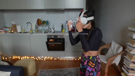 woman playing vr game in kitchen