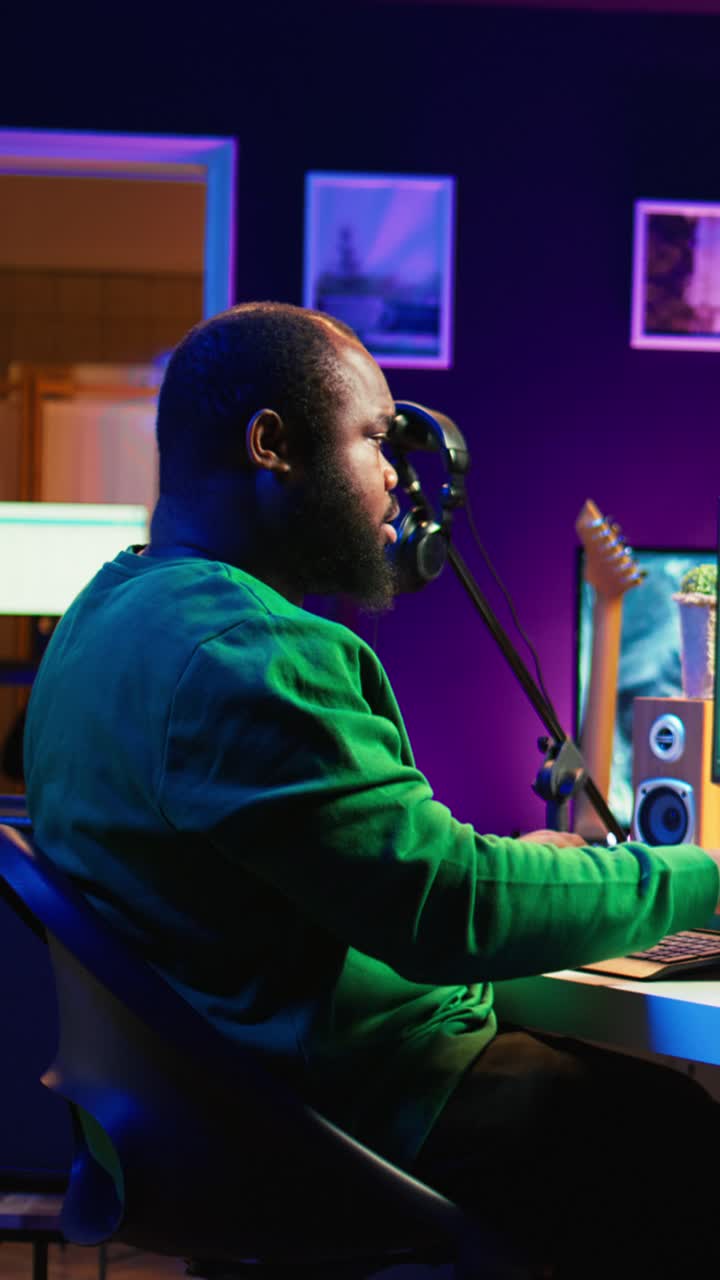 Focused Man Working on Music Production in Home Studio
