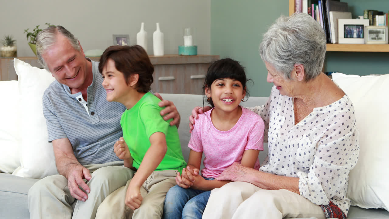 Grandparents with grandchildren in living room