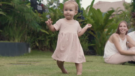 toddler walking away from parents outdoors