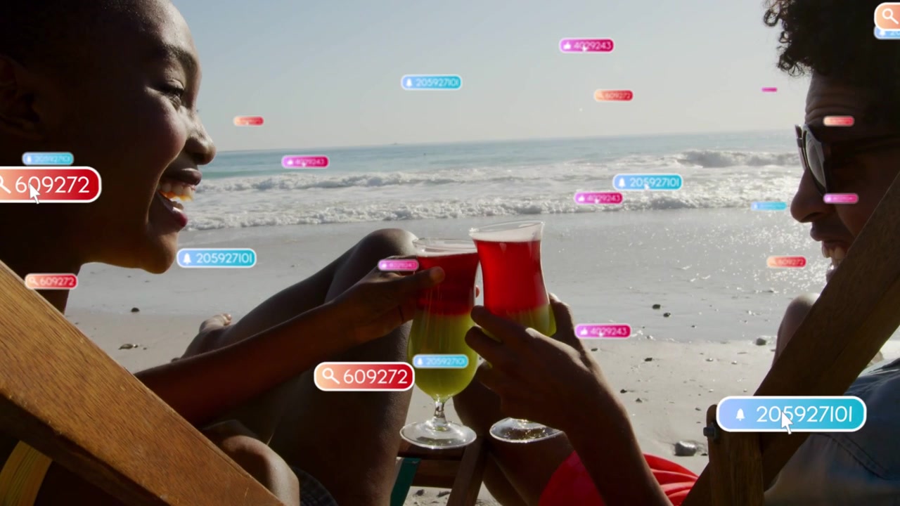 Woman and man clinking cocktails after camera widening, floating tags showing moment for travel