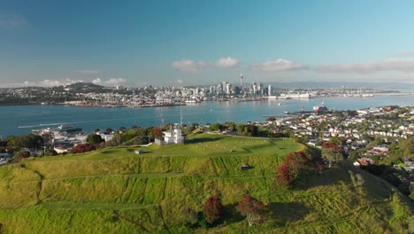 flying over mount victoria with auckland skyline in background, new zealand