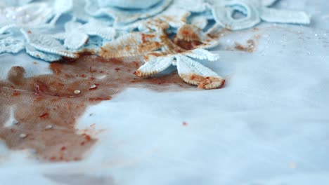 stained light blue lace fabric