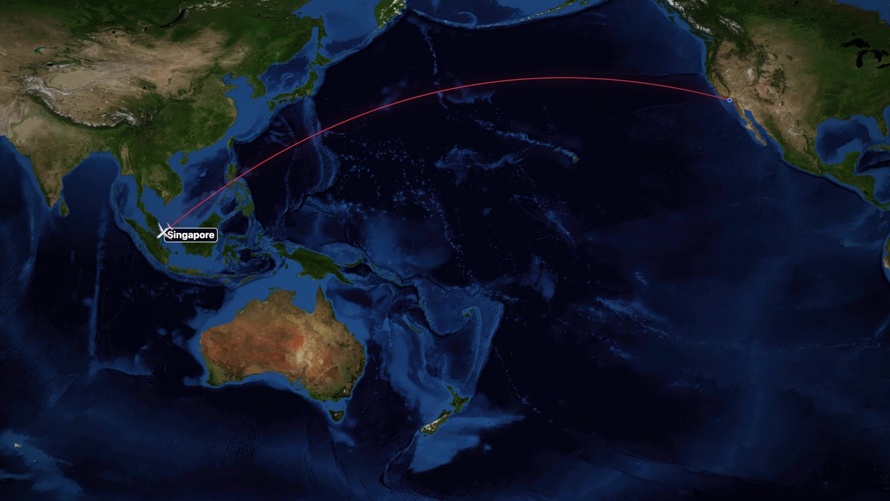 A red line tracks an airplane flying from Los Angeles to Singapore across the Pacific