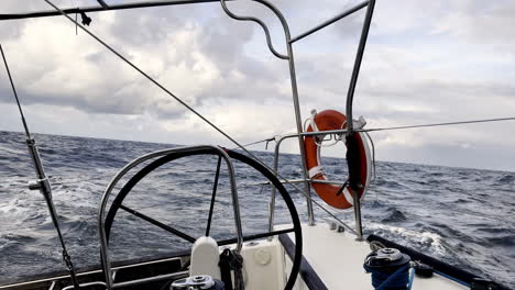 Yacht Plows Through Rough Seas Under a Menacing Sky, Capturing the Thrill and Challenge of Ocean Sailing Confronting the North Sea's Might