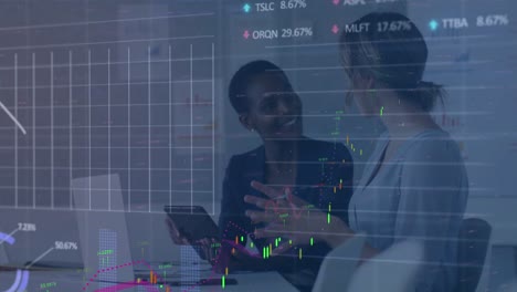 animation of graphs and trading data over diverse coworkers analyzing ideas over tablet in office