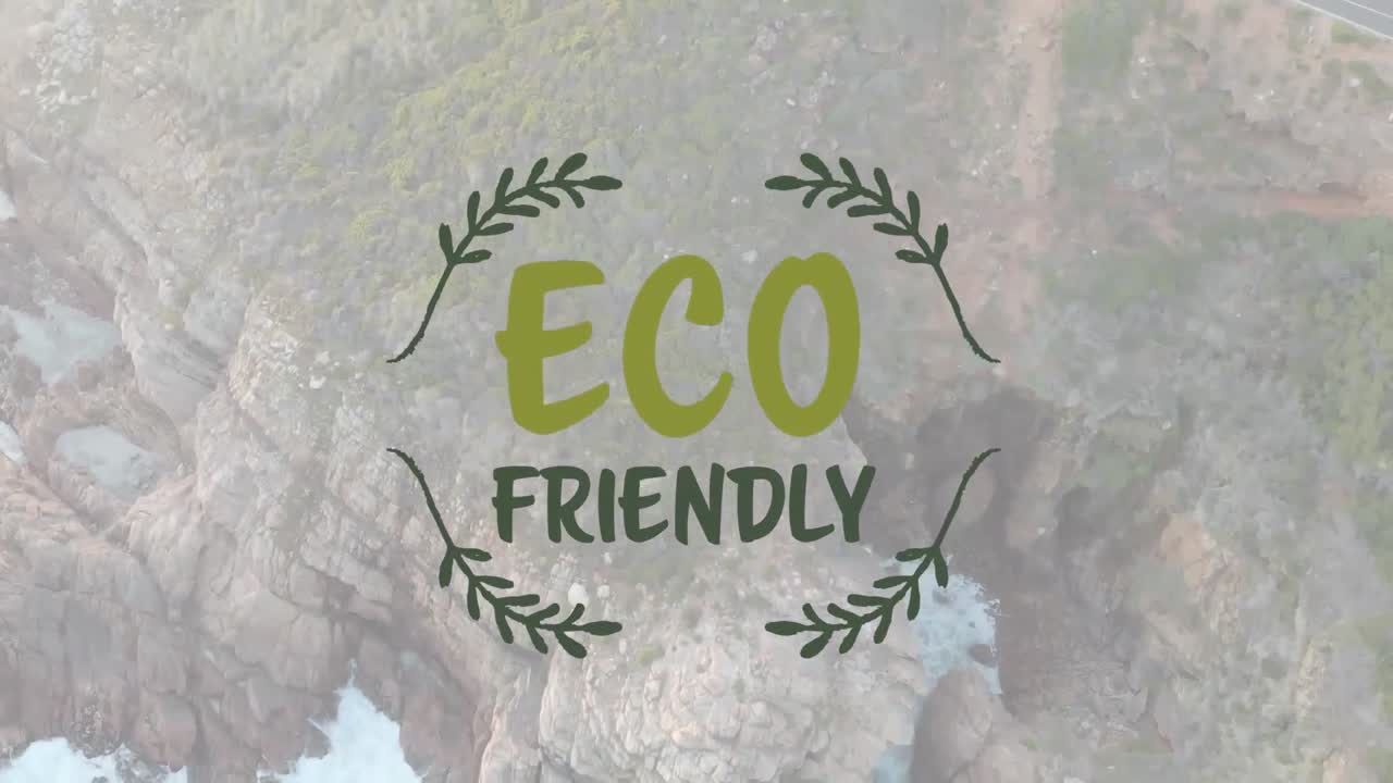 Animation of eco friendly text over ocean's rocky coast