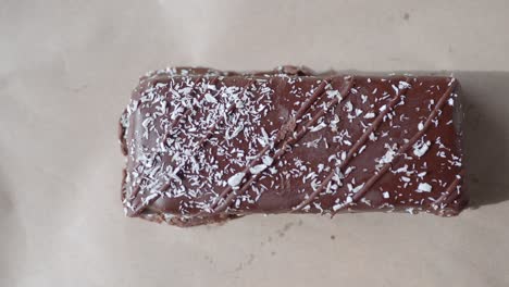 close up of a chocolate bar with coconut flakes