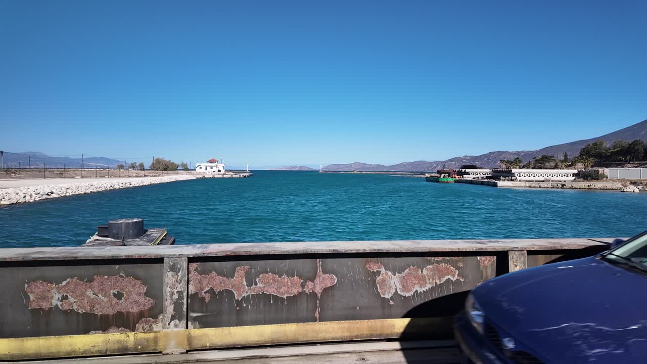 Traffic crossing Corinth canal submersible road bridge
